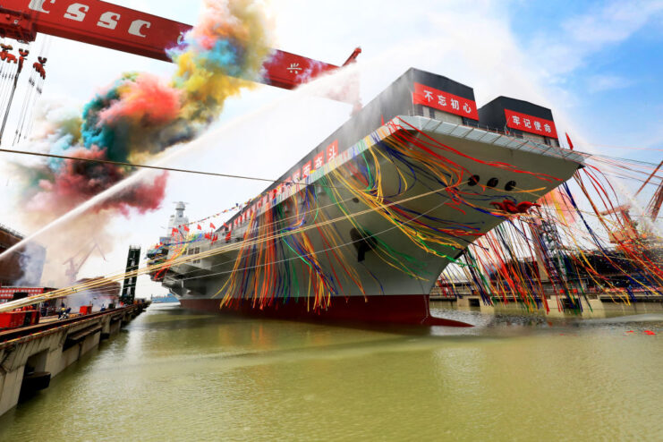 Type 003 Fujian, decorated with streamers, at port