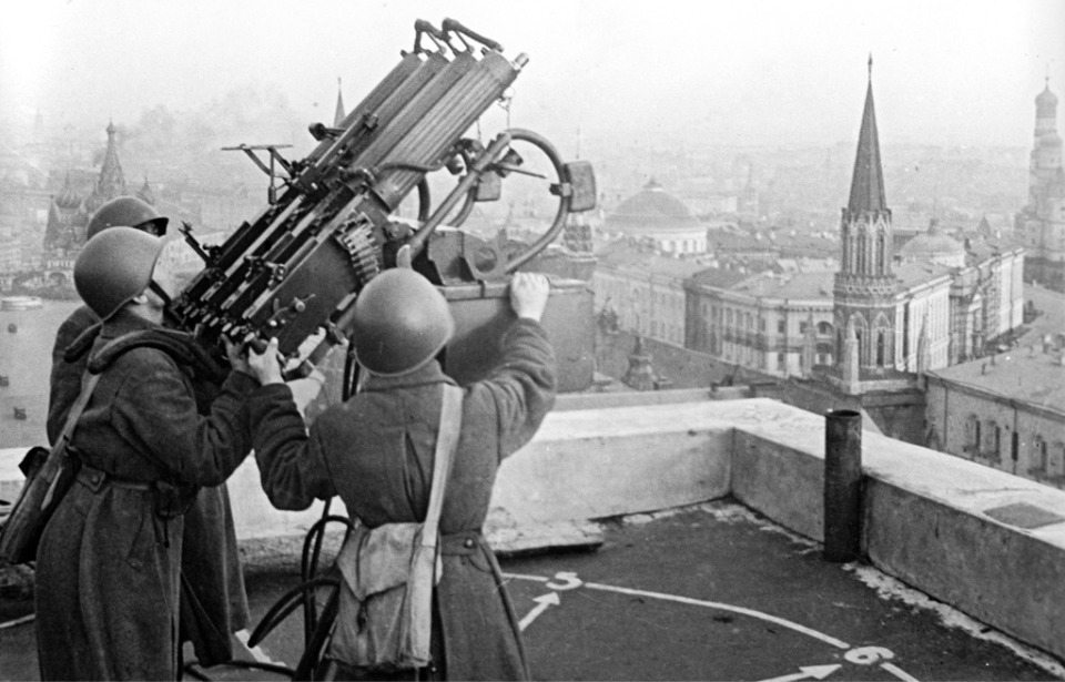 Three Red Army soldiers manning an anti-aircraft gun