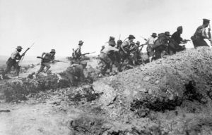 ANZAC troops running up a hill