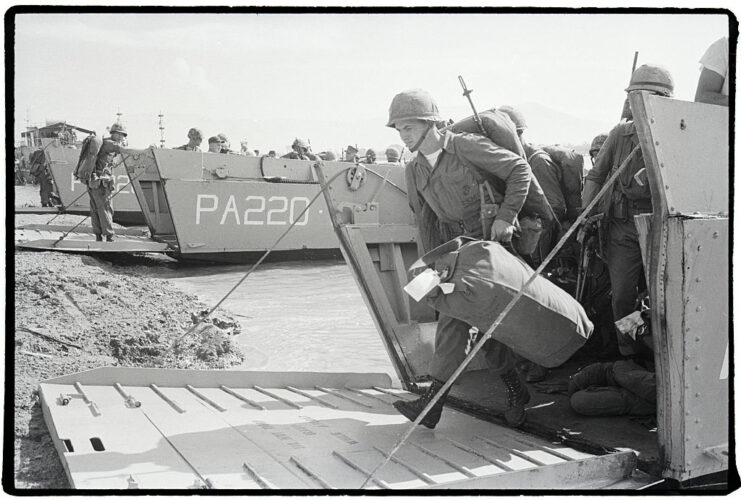 US Marines disembarking from landing craft on a beach