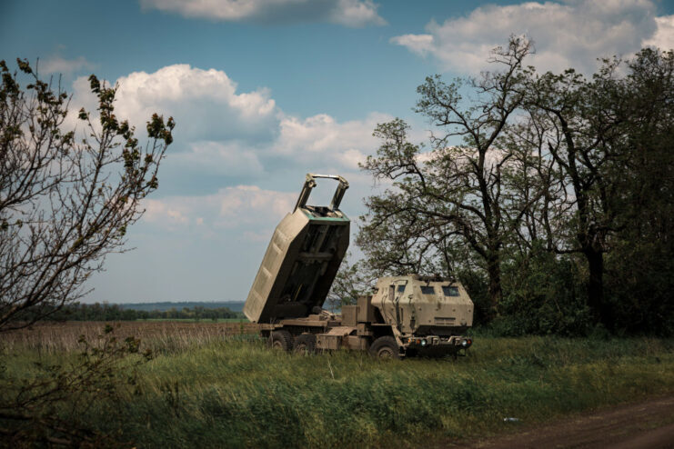 M142 HIMARS in the middle of a grassy area