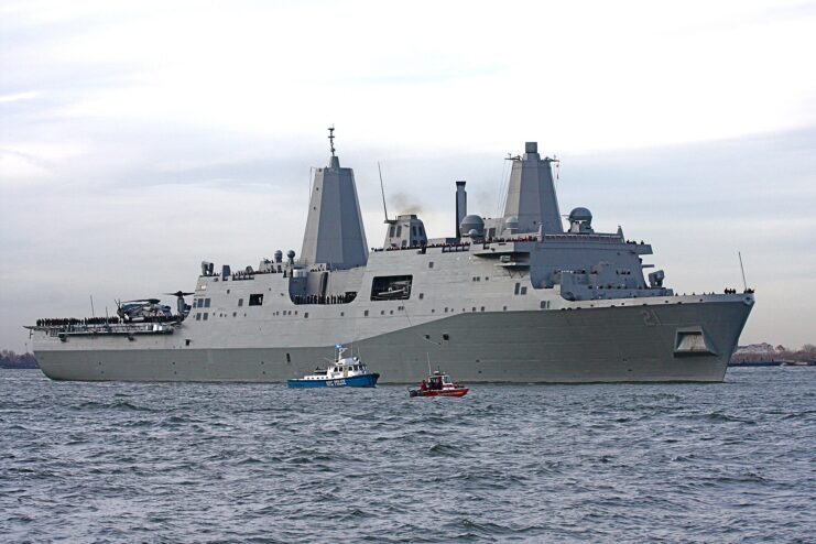 Two smaller boats near the USS New York (LPD-21)