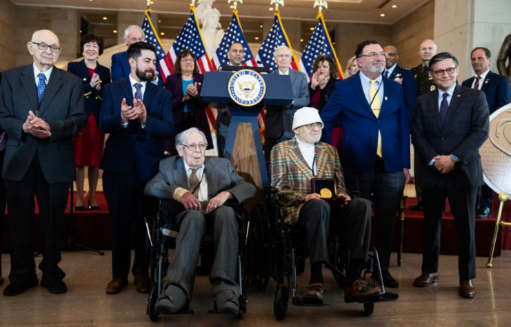 US government officials standing with Bernard Bluestein, Seymour Nussenbaum and John Christman