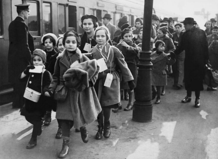 Children walking along a train platform