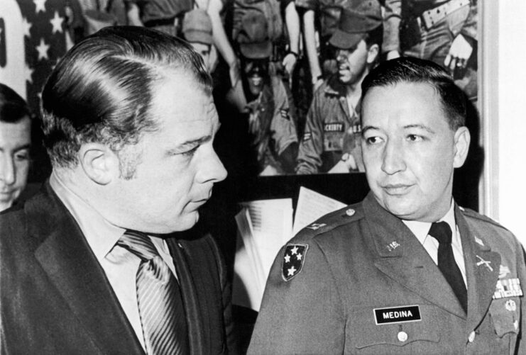 Capt. Ernest Medina standing with his attorney, F. Lee Bailey