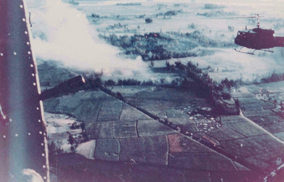 Aerial view of Mỹ Lai, with smoke rising into the air
