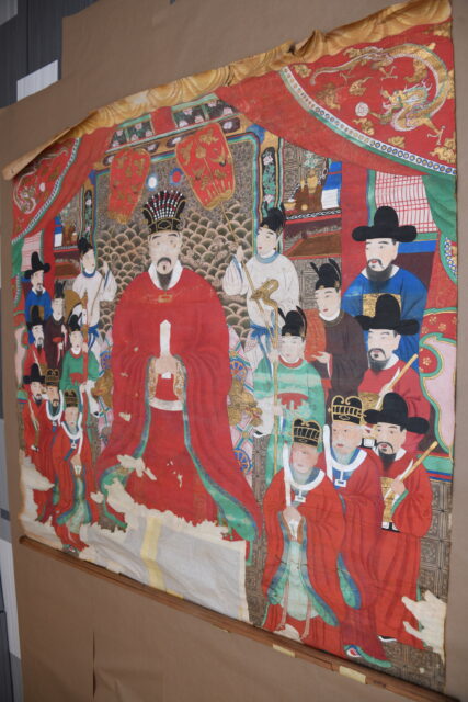 Scroll featuring an illustration of people dressed in historic Japanese clothing
