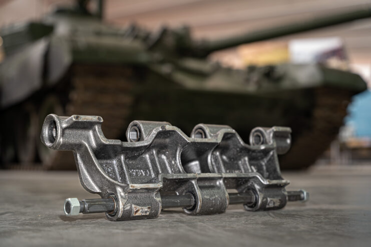 Tank track placed on the ground near a T72 that's on display