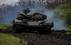 T72 driving through a field