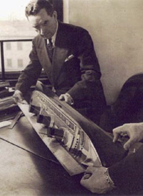 Vladimir Yourkevitch examining a model of the SS Normandie
