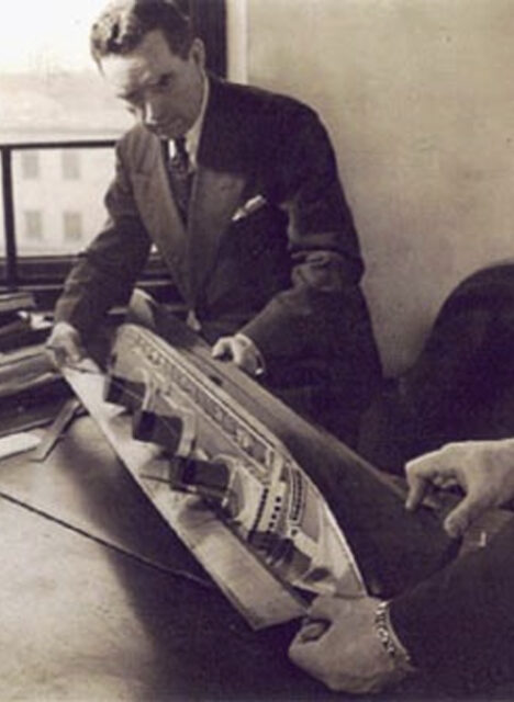 Vladimir Yourkevitch examining a model of the SS Normandie