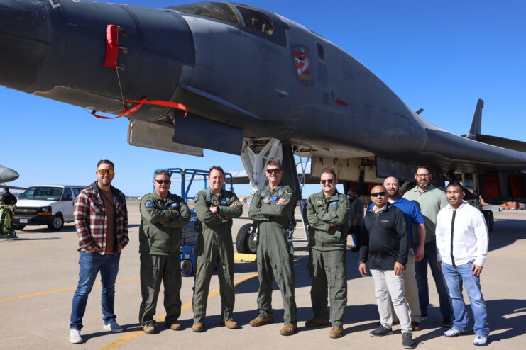 Members of the 10th Flight Test Squadron standing in front of the Rockwell B-1B Lancer 'Lancelot'