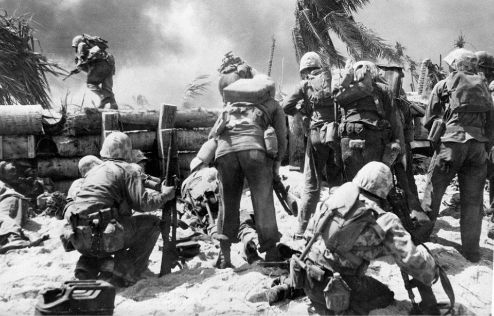 US Marines gathered around a fortified wall