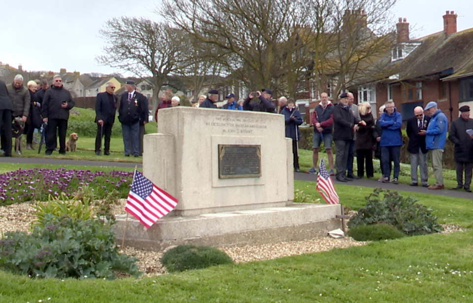 Crowd standing around the US D-Day Memorial in Victoria Gardens