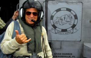 Jimmy Buffett standing in aviation gear