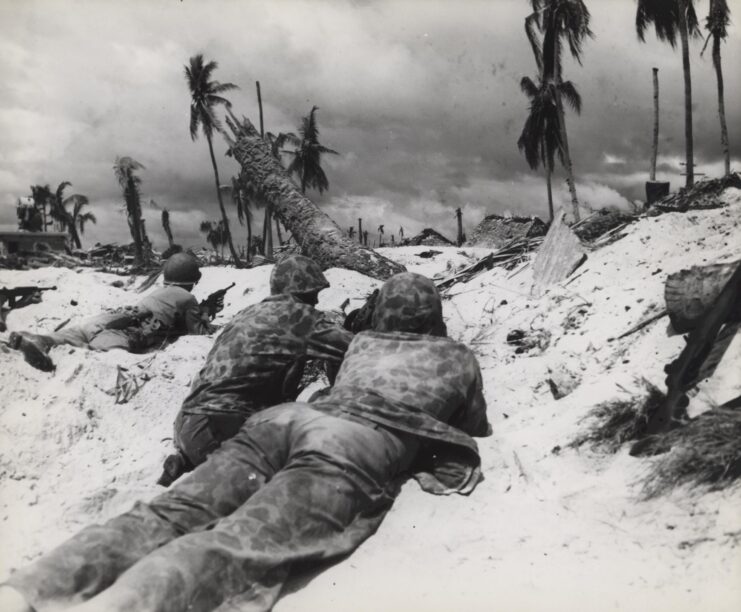 US Marines lying on their stomachs on the beach on Betio island