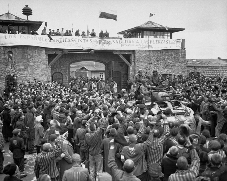 Prisoners cheering US Army soldiers at Mauthausen concentration camp