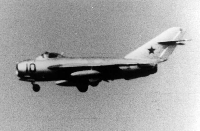 Mikoyan-Gurevich MiG-17 flying with its landing gear out