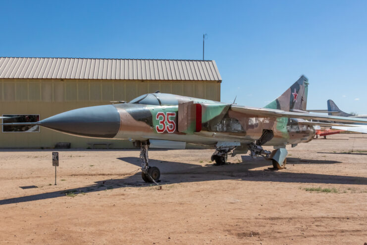 Mikoyan-Gurevich MiG-23 parked near a building