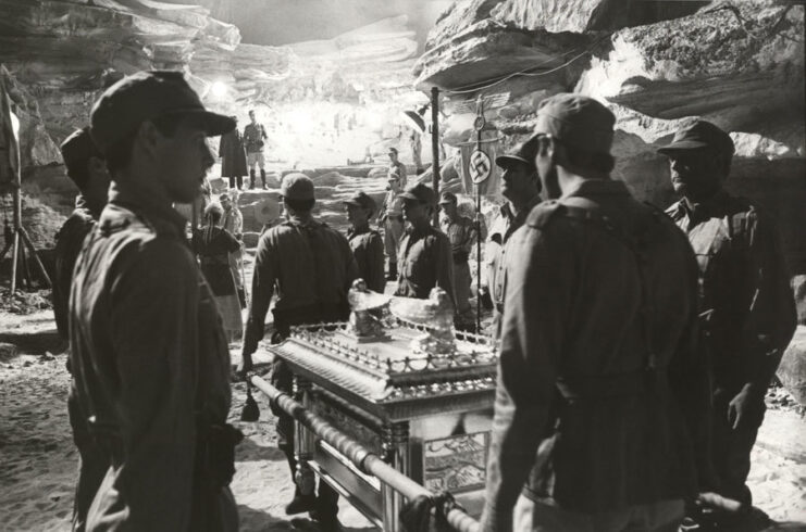Crewmen standing on the set of 'Raiders of the Lost Ark'
