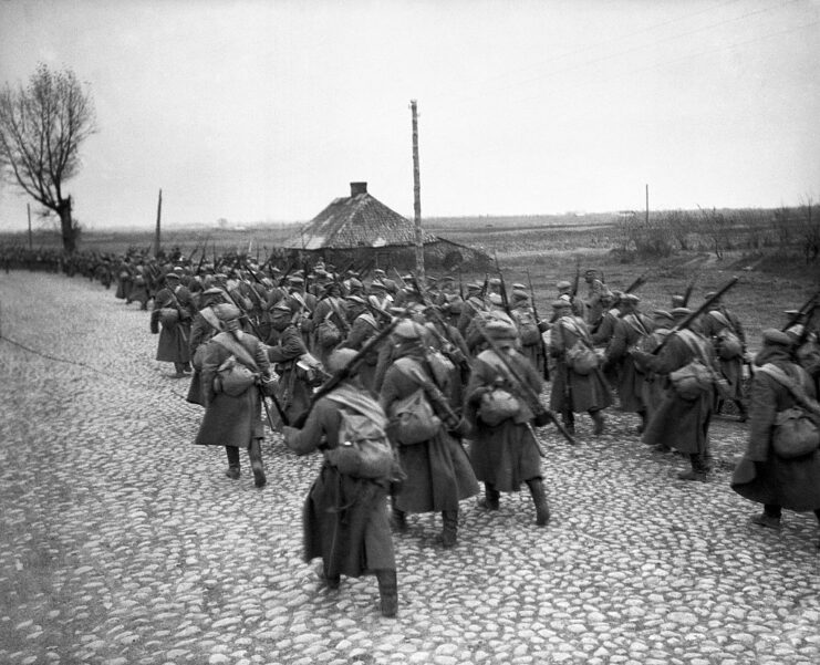 Russian infantrymen marching down a path