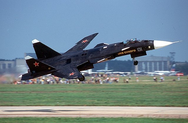 Sukhoi Su-47 'Berkut' taking off down a runway