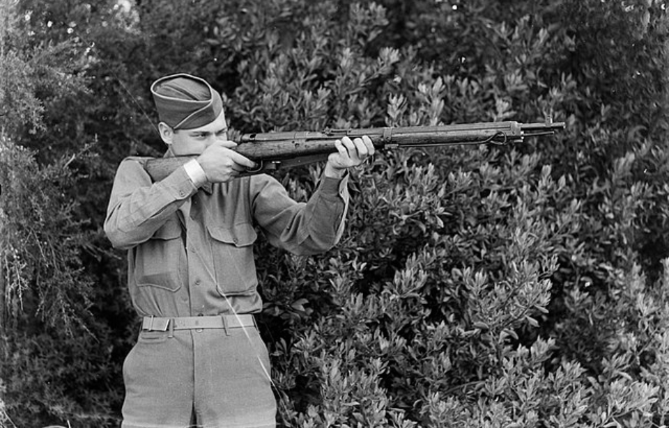 Soldier aiming an Arisaka Type 99 rifle