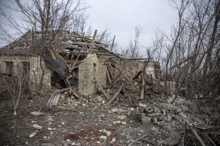 What remains of a house in the middle of a rubble-strewn area