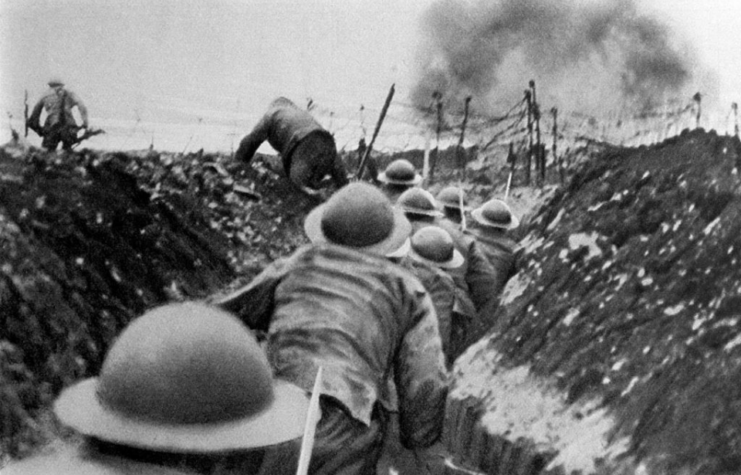 British soldiers running along a trench