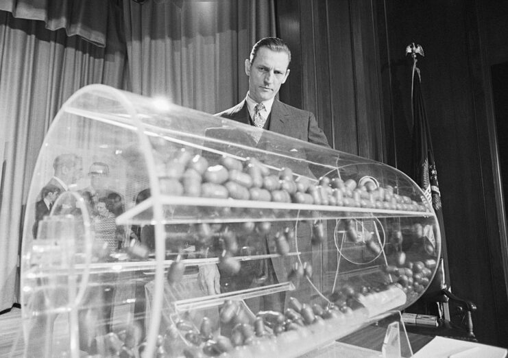 Curtis Tarr spinning a drum filled with capsules