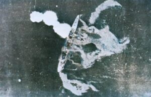 Aerial view of Japanese battleship sinking during the Battle of Bismarck Sea.
