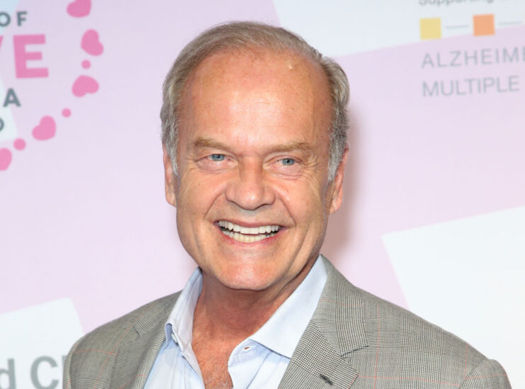 Kelsey Grammer standing on a red carpet