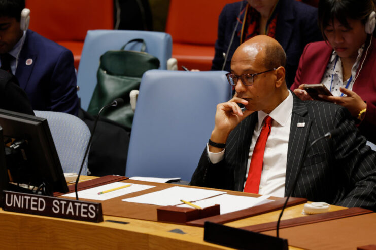 Robert Wood sitting at the desk designated for the United States at the United Nations (UN) Security Council