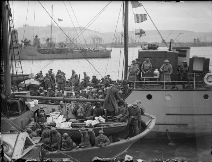 Black and white. Two boats with soldiers crowded on the decks. flags wave from the mast. Another boat can be seen in the background.