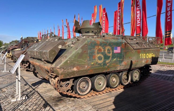 Military tanks lined up in a row outside