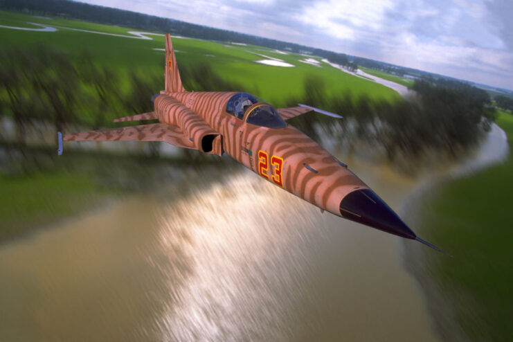 Northrop F-5E Tiger II in flight over a river