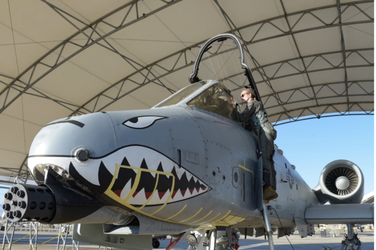 Taylor Bye entering the cockpit of a Fairchild Republic A-10C Thunderbolt II
