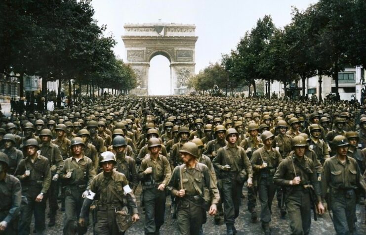 American troops marching down the Champs Elysees in France.