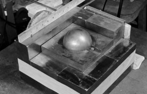 A sphere of plutonium surrounded by neutron-reflecting blocks of tungsten carbide.