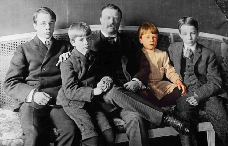 Theodore "Teddy" Roosevelt sitting with his sons on a couch