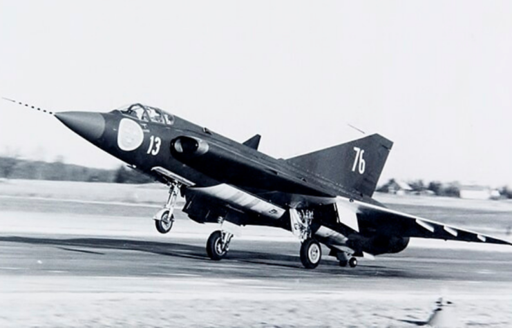 Saab J35 Draken taking off down a runway