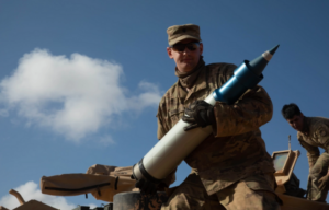 Spc. Gavin Hubbard holding a sabot round