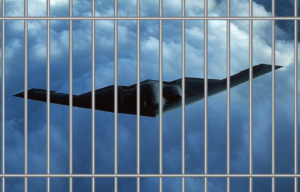Northrop B-2 Spirit in flight + Prison cell bars