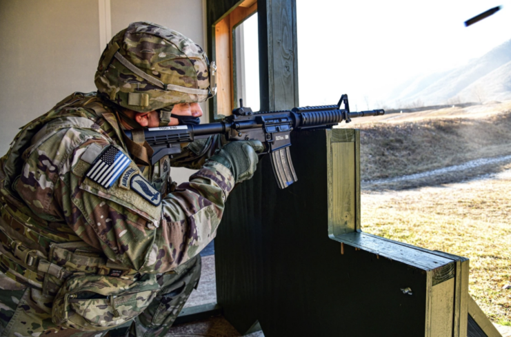Soldier with the US Army Southern European Task Force, Africa firing an M4 Carbine