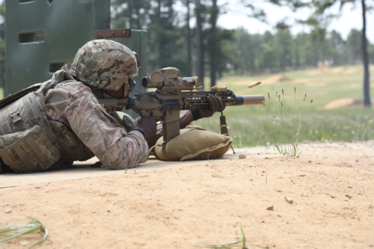 Sgt. Laharey Robinson firing an XM7