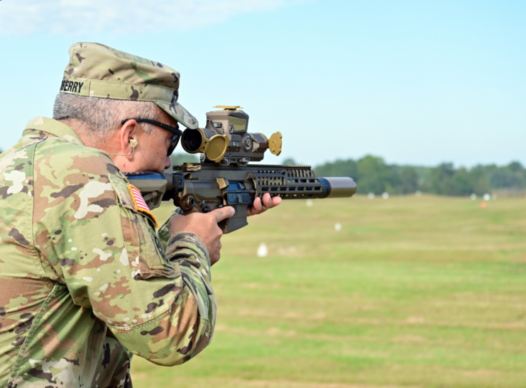 Col. Christopher Midberry aiming an XM7