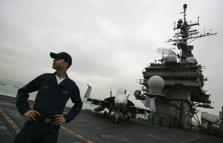 A crew member stands watch on the flight deck of the USS Kitty Hawk on April 28, 2008 in Hong Kong, China.