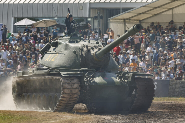M103 heavy tank driving around a dirt track