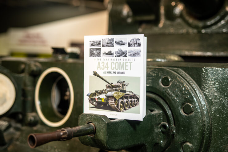 "The Tank Museum Guide to the A34 Comet" atop an armored vehicle