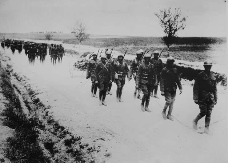 Harlem Hellfighters marching down a dirt road